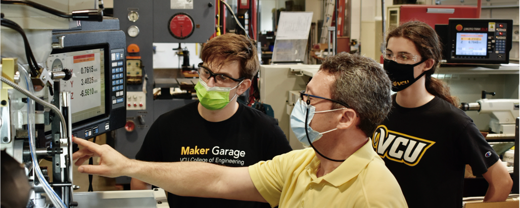 Students being trained inside of the Maker Garage