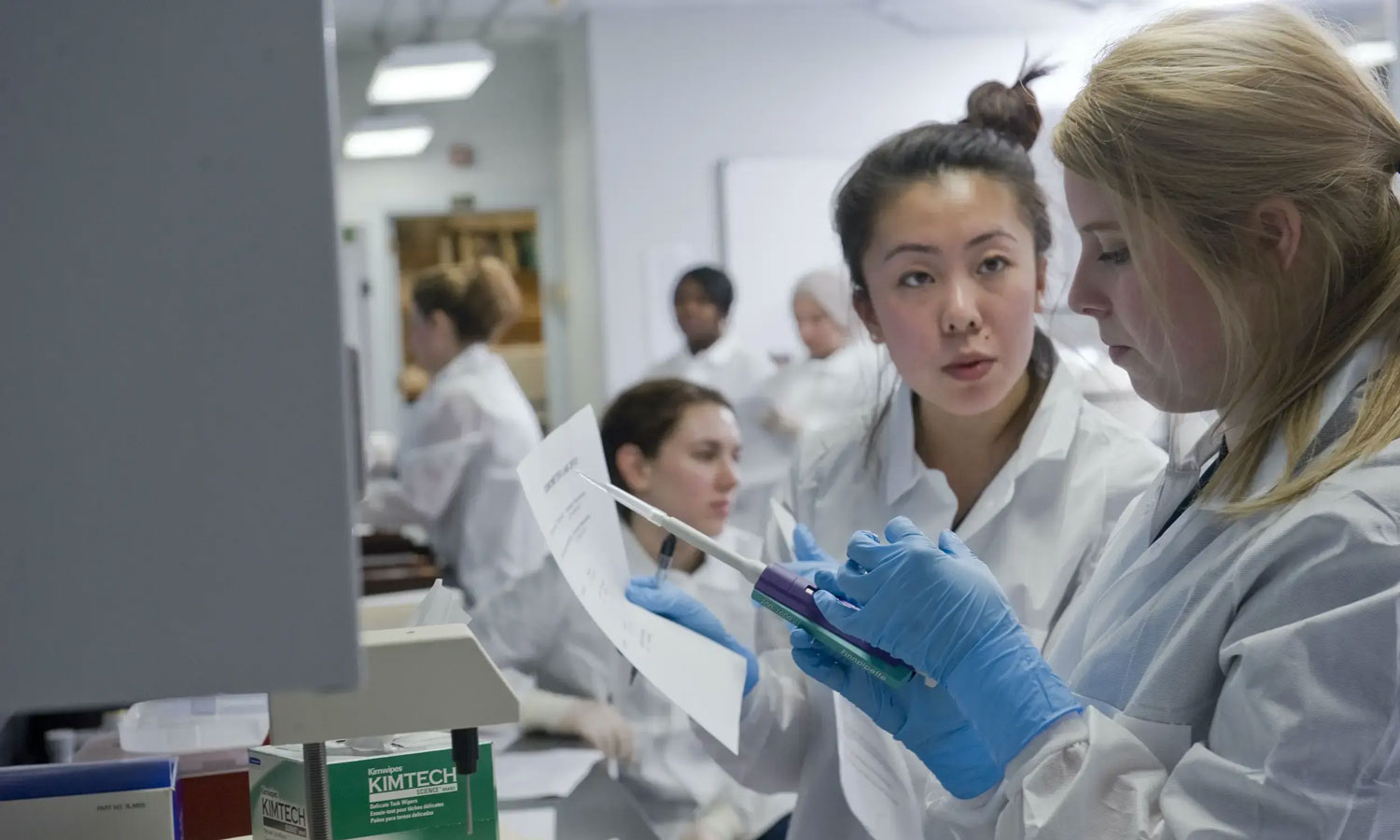 Two women working in a lab (University Marketing)