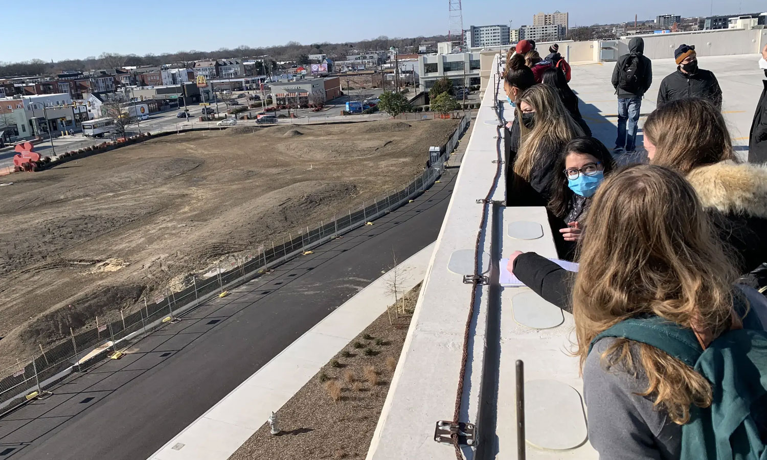 Students from the College of Humanities and Sciences and College of Engineering look over the Science Museum of Virginia's lot