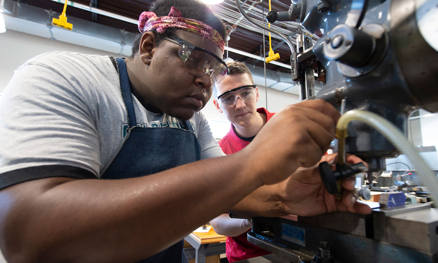 Two students working in the College of Engineering Maker Garage