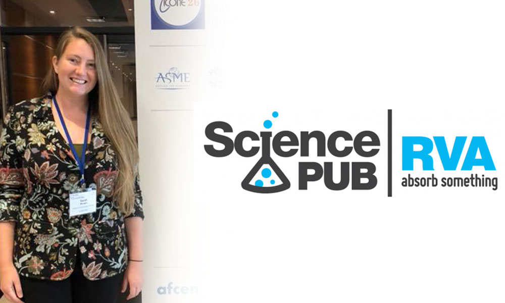 Sarah Morgan standing in front of a sign with Science Pub written on it.