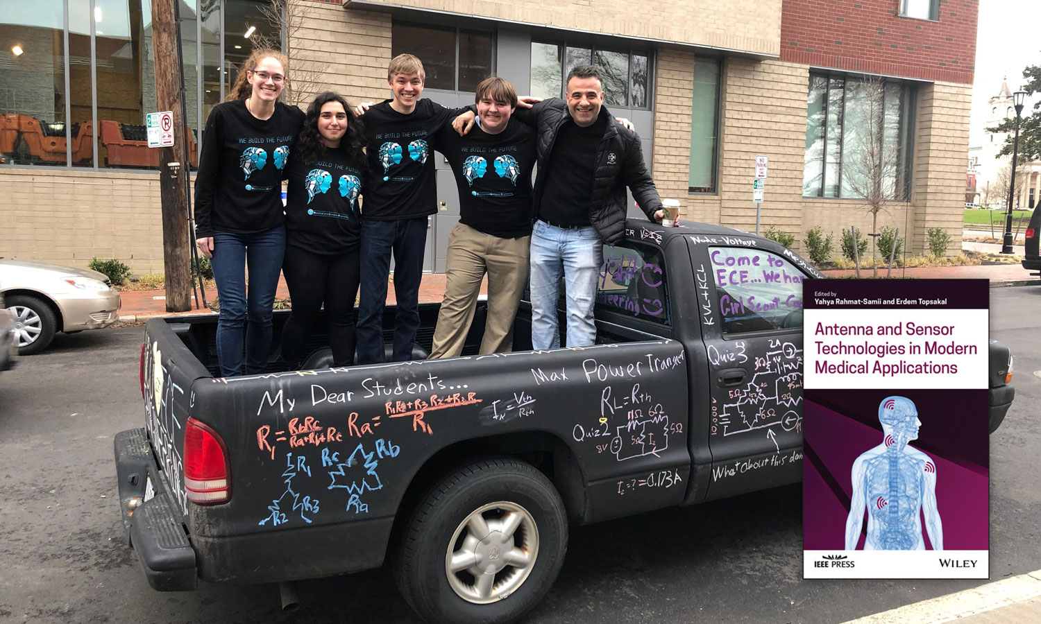 Erdem Topsakal, Ph.D., on a truck with a group of students