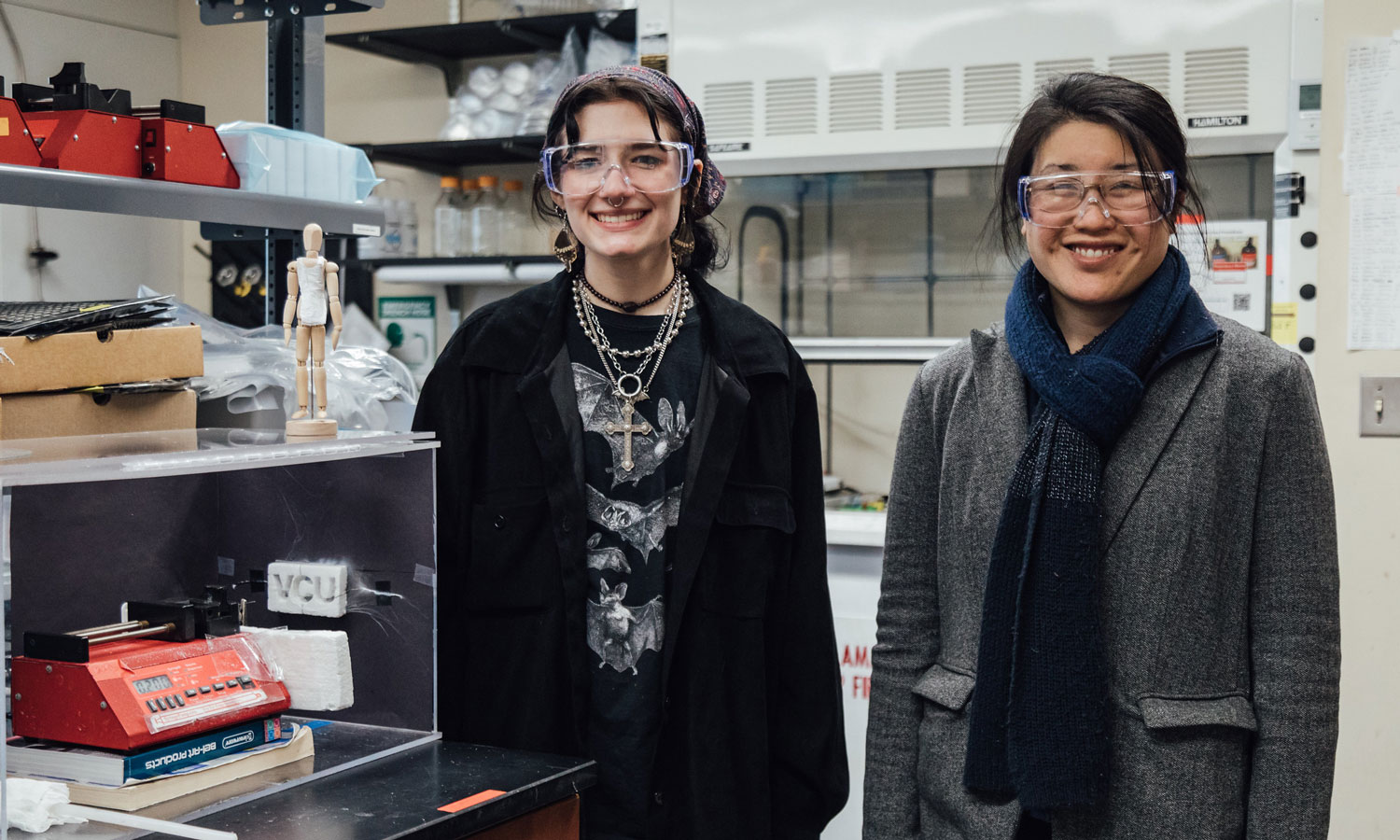 Left to right: Jocelyn Trapp and Christina Tang, Ph.D., associate professor of chemical and life science engineering, next to their electrospinning device.