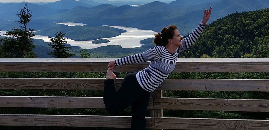 Kendra Gerlach performing yoga atop Whiteface Mountain outside Lake Placid, New York.