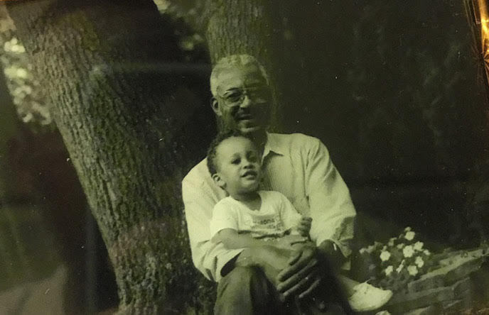 A young Jordan Thomas with his grandfather