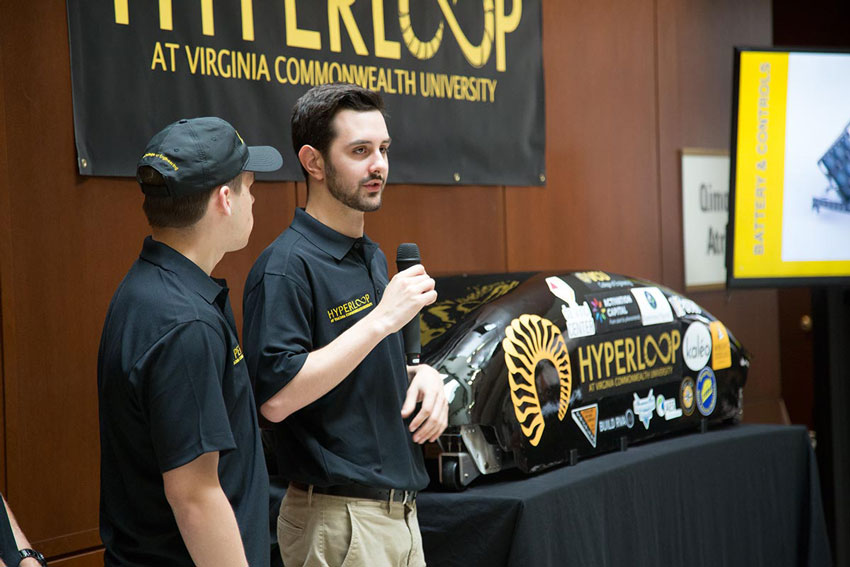 A student speaking at the Hyperloop pod unveiling on June 26, 2018
