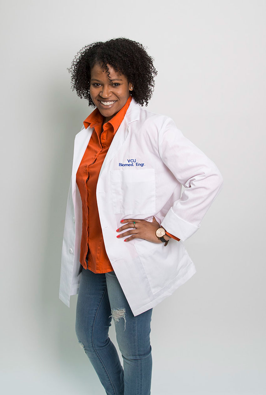Biomedical Engineering student Lauren Griggs in a lab coat
