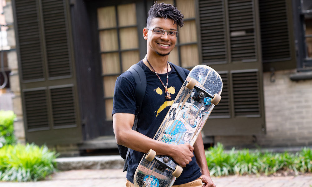 Tyriq Clay holding a skateboard